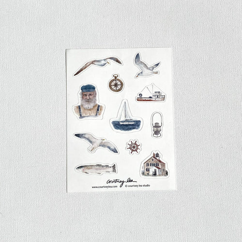 Set of nautical-themed stickers on a white card with a light gray background