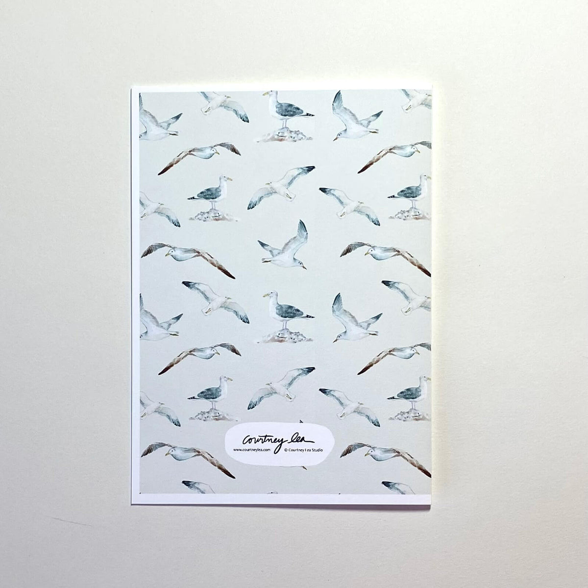 Back of greeting card with seagull pattern