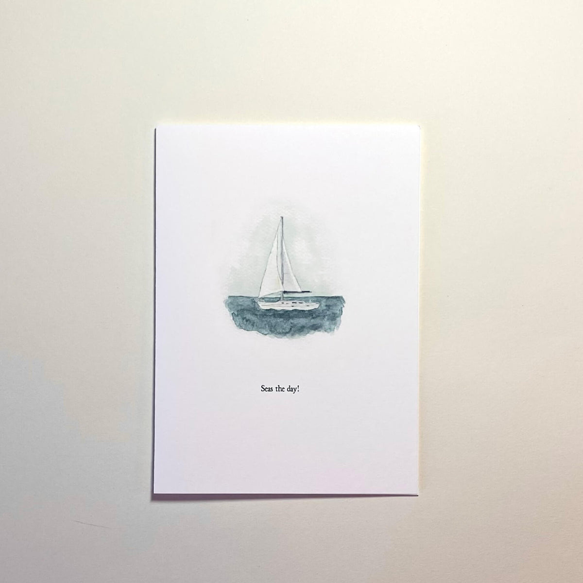 Greetingcard with a sailboat illustration and text on a white background